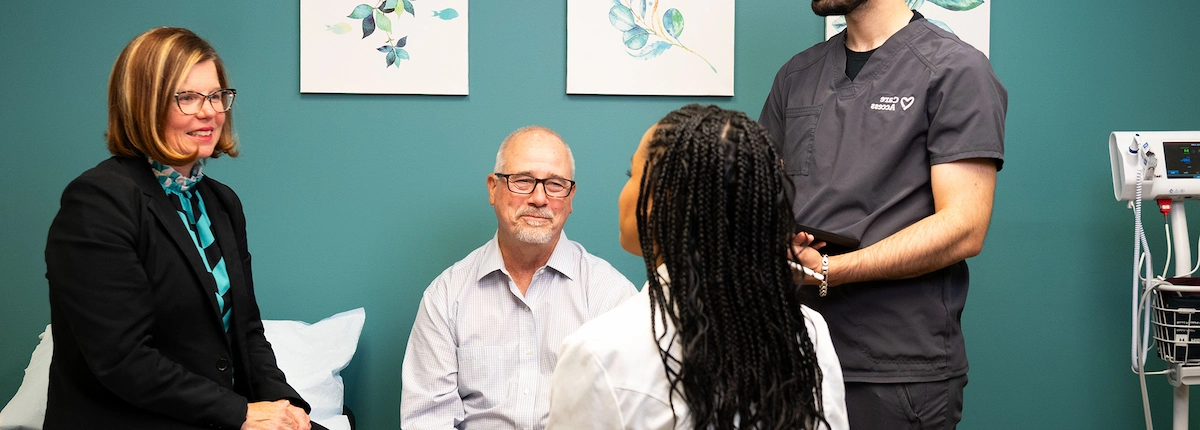 People speaking with doctor
